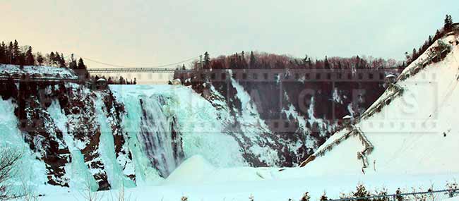 Chute Montmorency waterfall at sunset, winter landscape